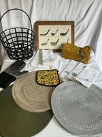 Group shot of all items including basket, placemats, napkins and potholder