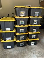Stack of Commander XL totes and HDX totes on garage floor