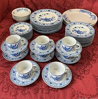 Overview of entire dinnerware set showing plates, bowls, cups and saucers