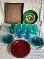 Overview of all items: plastic tumblers, bowls, plates, 7-Up tray, wood tray