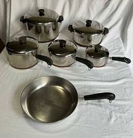 Full set of five lidded pots and one skillet displayed