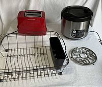 All four items together: Aroma rice cooker, KitchenAid toaster, dish rack, trivet