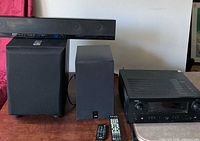 All audio components grouped: receiver, soundbar, subwoofer, speaker, remotes
