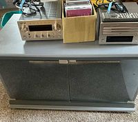 Front view of TEAC receiver, CD player, CDs and media cabinet
