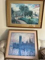Both framed Monet prints, garden scene hung on wall, Houses of Parliament resting on sofa