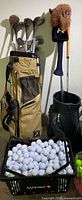 Overall lot with both bags, clubs and crate of balls