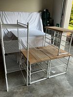 Group shot of three drawer units with wood tops and shelving tower