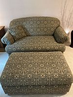 Front view of patterned XL arm chair and ottoman