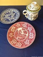 Group view: red plate, blue plate, lidded tea cup