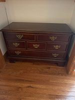 Front view of Lane cedar chest showing faux drawer fronts and hardware