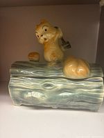 Cookie jar assembled showing squirrel lid and log body