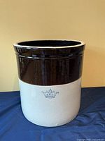 Front view showing full crock, blue crown mark and two-tone glazing