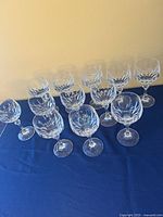 Full set of 12 cut crystal stemware glasses arranged on table