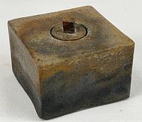 Three-quarter view of square stoneware incense burner showing mottled glaze and top lid