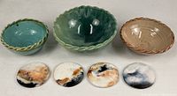 Group shot showing three bowls and four coasters