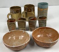 Group shot showing all nine pottery pieces