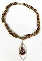 Full view of beaded necklace with pendant