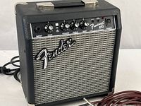 Front view of Fender Frontman 10G amplifier showing controls, grille, logo