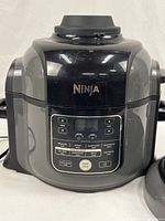 Front view of Ninja Foodi cooker base showing control panel