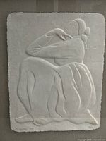 full view of paper cast relief showing seated woman and Gorman signature