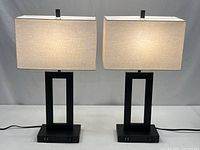 Pair of modern table lamps illuminated