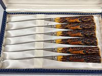 Six steak knives in satin-lined case