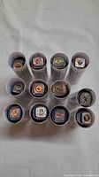 Top view of 12 rings in clear tubes showing team logos