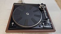 Top view of Dual 521 turntable showing platter, tonearm, controls, wood plinth