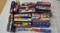 Assortment of boxed vacuum tubes from multiple brands, grouped in shipping trays