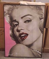 Full framed Marilyn Monroe portrait poster under glass