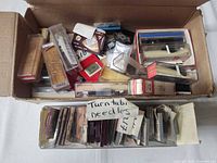 Open box of packaged needles and headshells