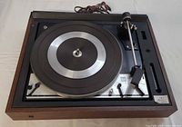 Top view of Dual 1216 turntable showing platter, tonearm and wood plinth