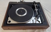 Full view of Dual 1225 turntable in wooden plinth