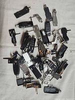 Pile of assorted headshells showing variety of shapes and colours