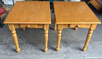 Front view of both wooden end tables showing drawers closed