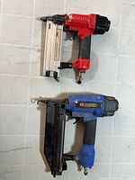 Clarke and Campbell Hausfeld pneumatic nailers side by side