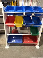 Front view showing frame and multicolour bins