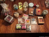 Full lot view showing jar candles, tealight packs, potpourri bag and pillar candle