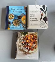 All three cookbooks arranged on table