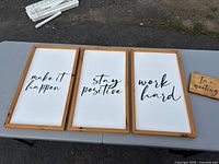 All four signs laid out showing text and frames