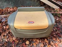 Front view of Little Tikes olive green toy chest with yellow lid