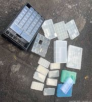 Group shot of drawer cabinet and loose compartment boxes spread on ground