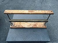 Full view of Globe paper cutter showing wood base, steel bar, uprights