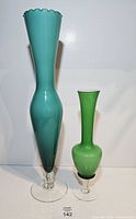 Both vases side by side for size and form comparison