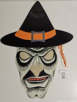 Front view of witch die-cut showing overall design