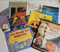 All eight books laid out showing front covers