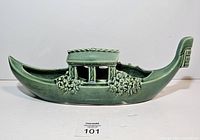 Side view of entire green glazed ceramic gondola planter