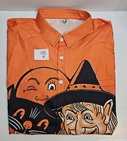 Folded shirt front showing graphic, buttons and collar