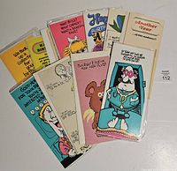 Stack of sleeved vintage greeting cards fanned out