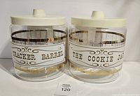 Front view of both Pyrex jars showing labels and lids